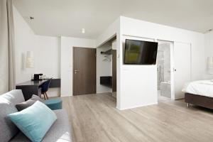 Uma cama ou camas num quarto em Hotel Hamar