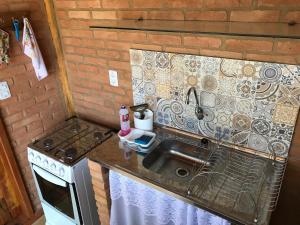 Kuchyň nebo kuchyňský kout v ubytování Chalés Sítio Do Tanque + 147 fotografií