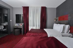 Postel nebo postele na pokoji v ubytování A11 Hotel