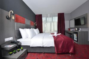 Postel nebo postele na pokoji v ubytování A11 Hotel