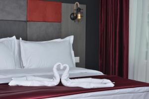 Postel nebo postele na pokoji v ubytování A11 Hotel