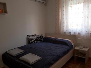 Postel nebo postele na pokoji v ubytování Apartman Ana