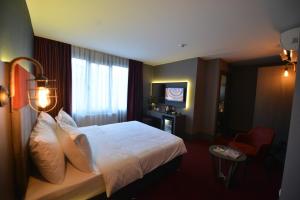 Postel nebo postele na pokoji v ubytování A11 Hotel