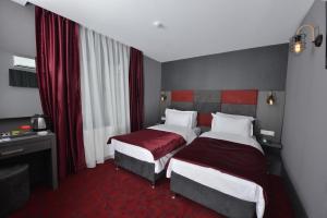 Postel nebo postele na pokoji v ubytování A11 Hotel