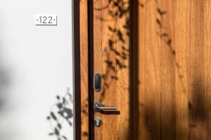 a close up of a wooden door with a timestamp at Semeli in Kokkari