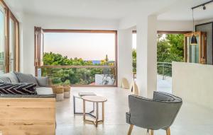 a living room with a couch and a table at Semeli in Kokkari