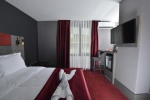 Postel nebo postele na pokoji v ubytování A11 Hotel