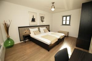 Letto o letti in una camera di Boutique Hotel Dvor