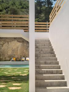 a set of stairs leading up to a building at Semeli in Kokkari