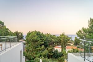 a view of the ocean from the balcony of a house at Semeli in Kokkari