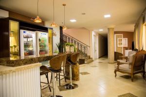 Posezení v ubytování Dois Vizinhos Palace Hotel