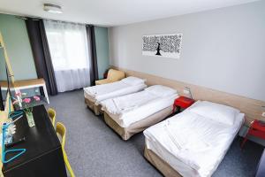Posteľ alebo postele v izbe v ubytovaní Tamada