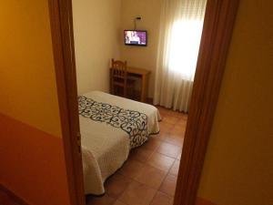 Postel nebo postele na pokoji v ubytování Hostal Orejas