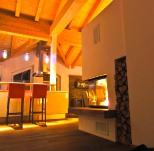 a living room with a fireplace in a house at TUX DIAMANT in Tux
