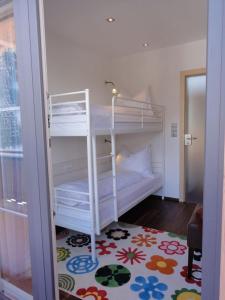 a bedroom with a bunk bed in a room at TUX DIAMANT in Tux