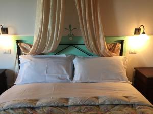 Ένα ή περισσότερα κρεβάτια σε δωμάτιο στο Agriturismo Il Puntoncino
