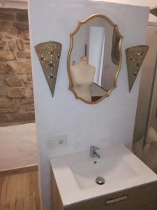 a bathroom with a sink and a mirror at La Mirilla Suites 2 in Tarifa +11 photos