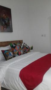 Postel nebo postele na pokoji v ubytování Anugrah Jaya Guest House
