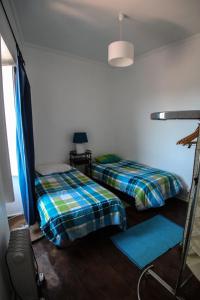 Postel nebo postele na pokoji v ubytování Casas do Pátio Sem Cantigas 4