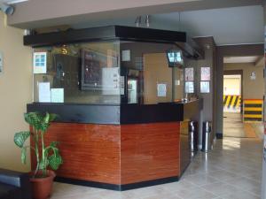 a restaurant with a counter in a building at Hotel Bohemia in Lima