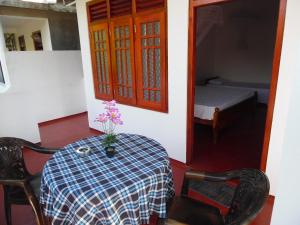 Postel nebo postele na pokoji v ubytování Bloom Guest House