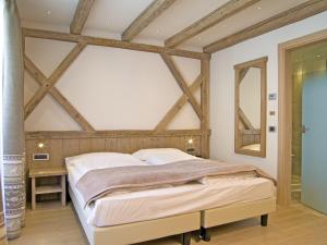 Postel nebo postele na pokoji v ubytování Hotel Alba