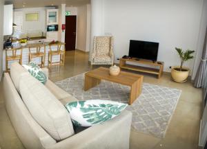 TV a/nebo společenská místnost v ubytování The Quadrant Luxury Apartments