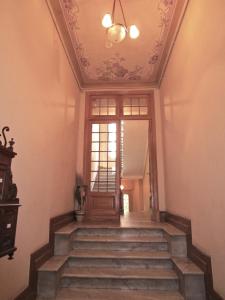 a staircase in a house with a ceiling at Appartement in Nice