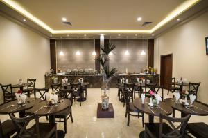 Restaurace v ubytování لي لي المبرز للشقق المخدومة - درجة اقتصادية