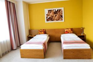 Voodi või voodid majutusasutuse Afrika Hotel Frýdek-Místek toas