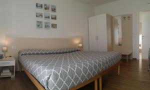 Postel nebo postele na pokoji v ubytování B&B Tomaselli