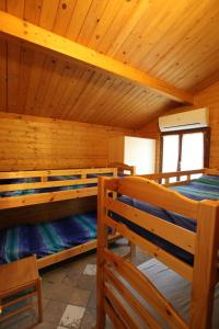 A bed or beds in a room at Campeggio Boscoverde