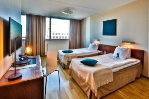 Cama o camas de una habitación en First Hotel Jörgen Kock