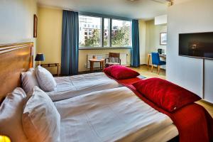Cama o camas de una habitación en First Hotel Jörgen Kock