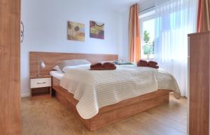 En eller flere senge i et værelse på Ferienwohnungen Amrumbank