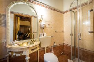 a bathroom with a sink and a shower at Soggiorno Annamaria in Florence