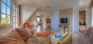 Et tv og/eller underholdning på Ferienwohnungen Amrumbank