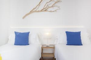 Una cama o camas en una habitación de Villa Cala Padri