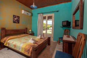 Giường trong phòng chung tại Augoustinos Villa +68 ảnh