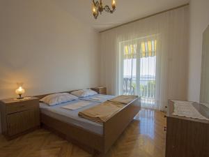 Postel nebo postele na pokoji v ubytování Apartments Antonio