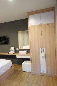 a bedroom with a bed and a large closet at The Sea Condo Cozy Private Room at Ao nang Krabi in Ao Nang Beach