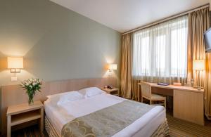 Кровать или кровати в номере Гостиница Скайпорт