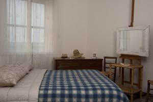 Un pat sau paturi într-o cameră la L'incrocio - Bed&Breakfast