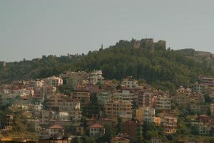 a view of a town on a hill with houses at Sailorson Apart Hotel in Alanya