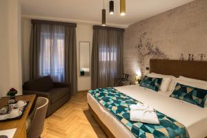 Postel nebo postele na pokoji v ubytování Navona Essence Hotel