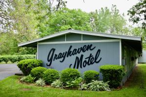 a sign on the side of a building at The Grayhaven Motel in Ithaca