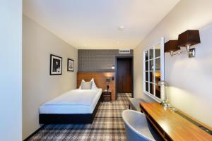 Postel nebo postele na pokoji v ubytování Hotel City Zürich Design & Lifestyle