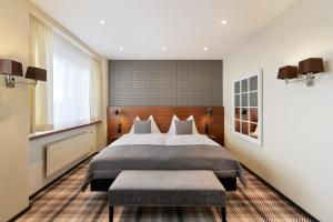 Postel nebo postele na pokoji v ubytování Hotel City Zürich Design & Lifestyle