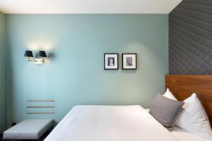 Postel nebo postele na pokoji v ubytování Hotel City Zürich Design & Lifestyle