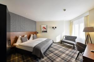Postel nebo postele na pokoji v ubytování Hotel City Zürich Design & Lifestyle